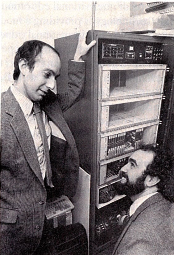 Two men, Henry Leitner and Daniel Goroff, speak with a class via telephone.